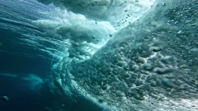 Underwater Hawaii 4k. Beautiful ocean wave, powerful wave breaking in slow motion. North shore Pipeline, Oahu. Adventure action water sports travel, surf destination.