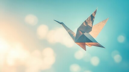 A lowangle shot of an origami crane suspended in midair by invisible strings