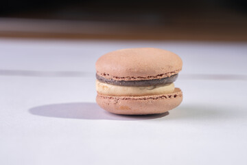This is a French cookie called a macaron. It is two cookies made with meringue and cream sandwiched between them.