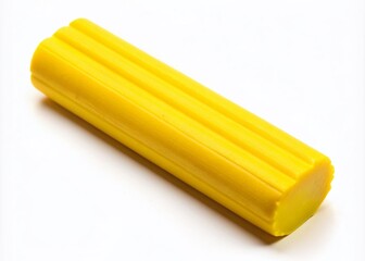 Vibrant yellow modeling clay stick, commonly used for artistic and creative projects, lies horizontally on a clean white background, awaiting inspiration.