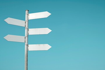 five white street signs are on a pole