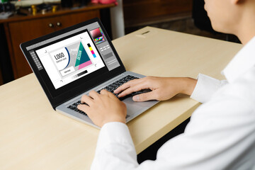 Graphic designer software for modern design of web page and commercial ads showing on the computer screen