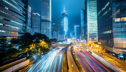 Obraz premium A bustling city at night, with skyscrapers illuminated and traffic creating streaks of light