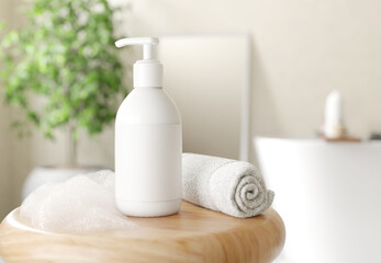 White cosmetic bottle pump on wooden stool with towel and foam