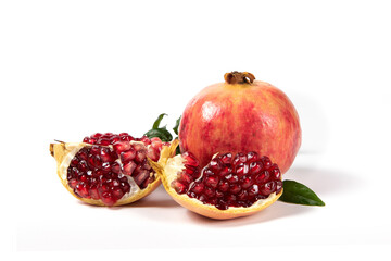 open pomegranates, and pomegranate seeds isolated on white background.