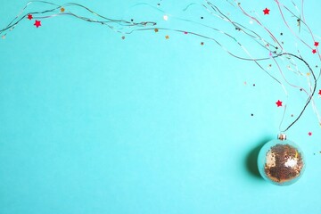 Retro Glam Christmas Disco Ball Ornament Shining on Pastel Blue Background