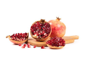 open pomegranates, and pomegranate seeds isolated on white background.