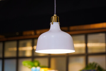 Obraz premium The beautiful modern design of ceiling lamp light bulbs in the shape of a white bell made of metal for home and living room decoration. Contemporary interior design.