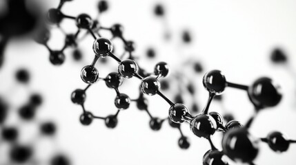 Close-up of a molecular structure showcasing interconnected atoms, highlighting the beauty of scientific design in black and white.
