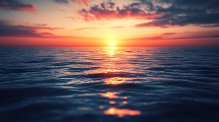 Fototapeta premium Waves gently kiss the shore as the sun sets in peace.