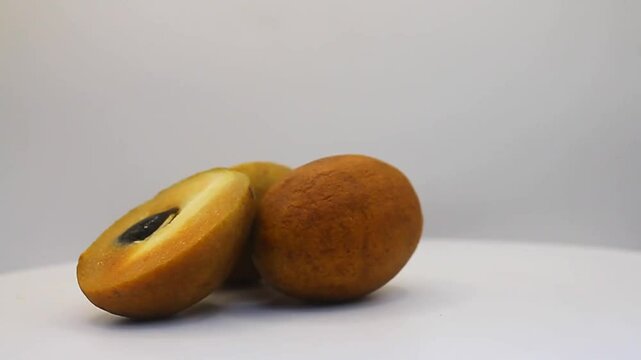 sapodilla fruit on a white background