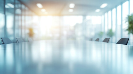 Blurry office meeting scene featuring indistinct figures in a corporate setting. The image symbolizes business discussions, collaboration, teamwork, and decision-making processes in a modern work envi