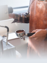 Barista preparing fresh espresso using a professional coffee machine, showcasing the craft of specialty coffee