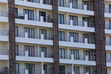 Close up of tall building with a skyscraper background.