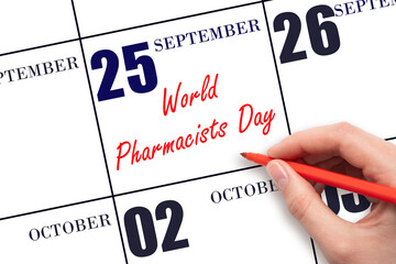 September 25. Hand writing text World Pharmacists Day on calendar date. Save the date.