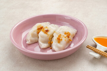 Choipan, made from rice flour filled with shredded jicama and sprinkled with fried garlic. Traditional steamed snack from Pontianak, Indonesia.
