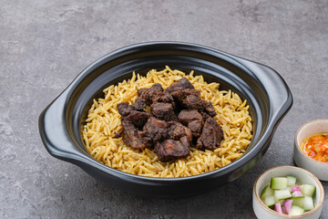 Nasi Kebuli Kambing, Arabian Rice with herb, spices and goat meat topping
