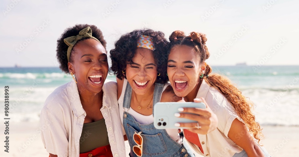 Canvas Prints Happy women, friends and laughing with selfie at beach for funny holiday or summer vacation together. Young, group or female person with smile, hug or humor for picture, memory or moment by ocean