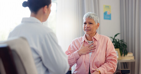 Doctor, consultation and senior woman with chest pain for heart disease, checkup and medical advice. Healthcare, patient and worker with discussion for cardiac arrhythmia, palpitations and diagnosis