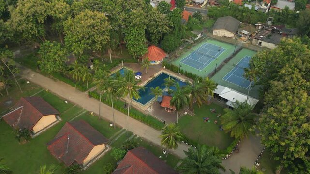 Relaxing Resort Pool Nestled Amongst Palm Trees Near Tennis Court In Banten Indonesia 4K 60FPS