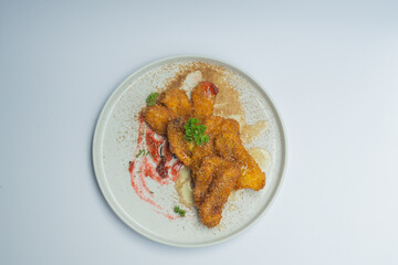 banana with fried flour food with honey and strawberry sauce