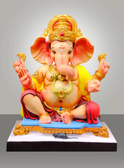 Hindu God Ganesha on gray color background, Ganesha Idol. Ganesh festival.