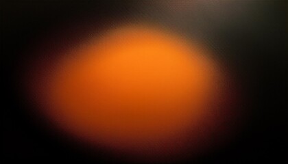 A vibrant orange light source illuminates a dark background with a soft focus