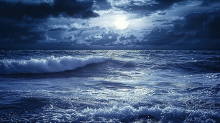 Fototapeta premium Dark Ocean Waves Wallpaper. Gentle waves of a dark ocean under a cloudy night sky.