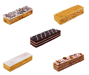 Five different rectangular cakes laying horizontally on white background