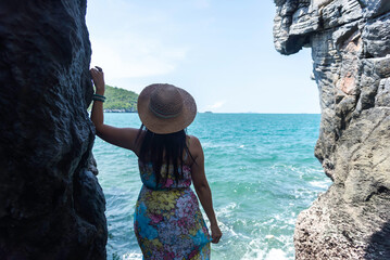 Woman Enjoying Summer Vacation, blue sky background. Travel and lifestyle Concept