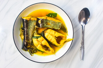 a plate of fish soup