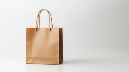 Minimalist brown paper shopping bag on a simple white background, with gentle lighting. No logo, no people.
