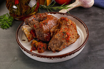 Baked beef ribs with vegetables