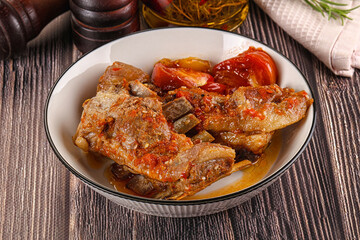 Baked lamb ribs with vegetables