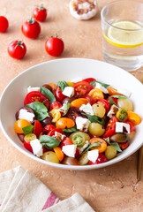 Salad with tomatoes, feta cheese, basil and balsamic vinegar. Healthy food. Vegetarian food.