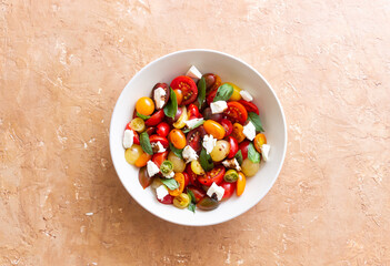 Salad with tomatoes, feta cheese, basil and balsamic vinegar. Healthy food. Vegetarian food.