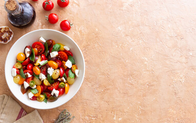 Salad with tomatoes, feta cheese, basil and balsamic vinegar. Healthy food. Vegetarian food.