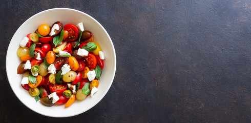Salad with tomatoes, feta cheese, basil and balsamic vinegar. Healthy food. Vegetarian food.