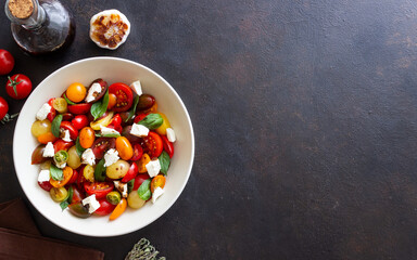 Salad with tomatoes, feta cheese, basil and balsamic vinegar. Healthy food. Vegetarian food.