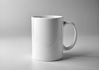 Fototapeta premium Isolated realistic white ceramic mug on a clean background, perfect for showcasing branding, logos, or designs in a professional and visually appealing presentation.