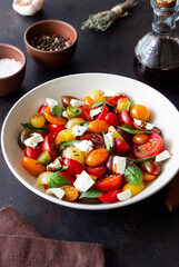 Salad with tomatoes, feta cheese, basil and balsamic vinegar. Healthy food. Vegetarian food.