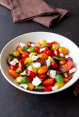 Salad with tomatoes, feta cheese, basil and balsamic vinegar. Healthy food. Vegetarian food.