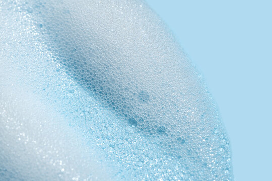 texture foam mousse foam cosmetic smear sample on blue background