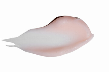 Face pink cream stroke isolated on white background. creamy smear smudge sample. face or body skincare product swatch. showcase of the product