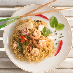 A bowl of instant noodles with seafood