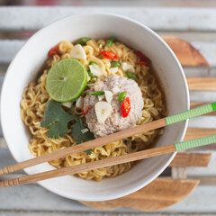 A bowl of instant noodles with minced pork