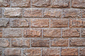 Brown brick blocks, brickwork. the texture of the wall.