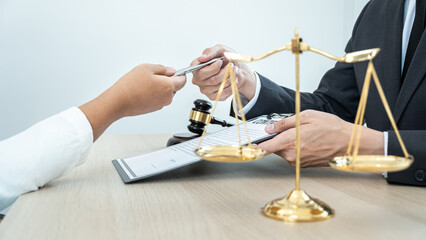 Obraz premium Male lawyer or notary working consulting and discussion to businesswoman client in the office, Law and Legal services concept