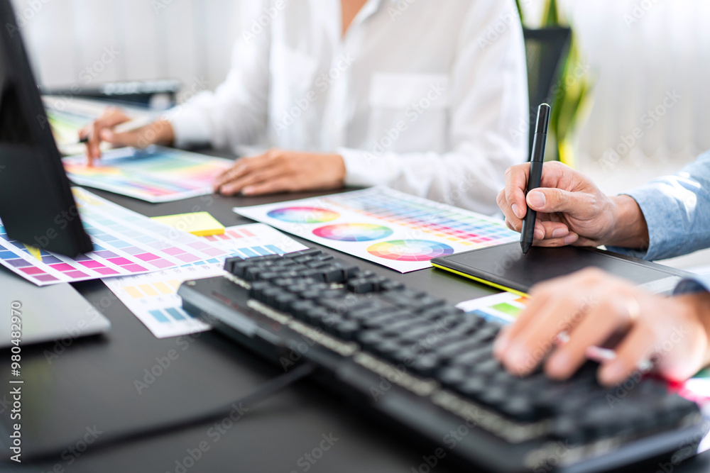 Aufkleber Team of creative graphic designer working on color swatch samples chart for selection coloring in inspiration to create new collection at workplace
