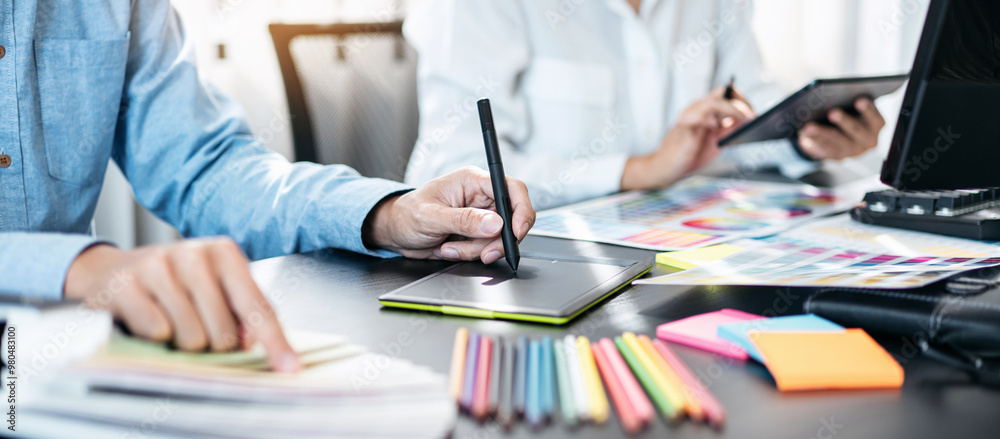 Poster Team of creative graphic designer working on color swatch samples chart for selection coloring in inspiration to create new collection at workplace